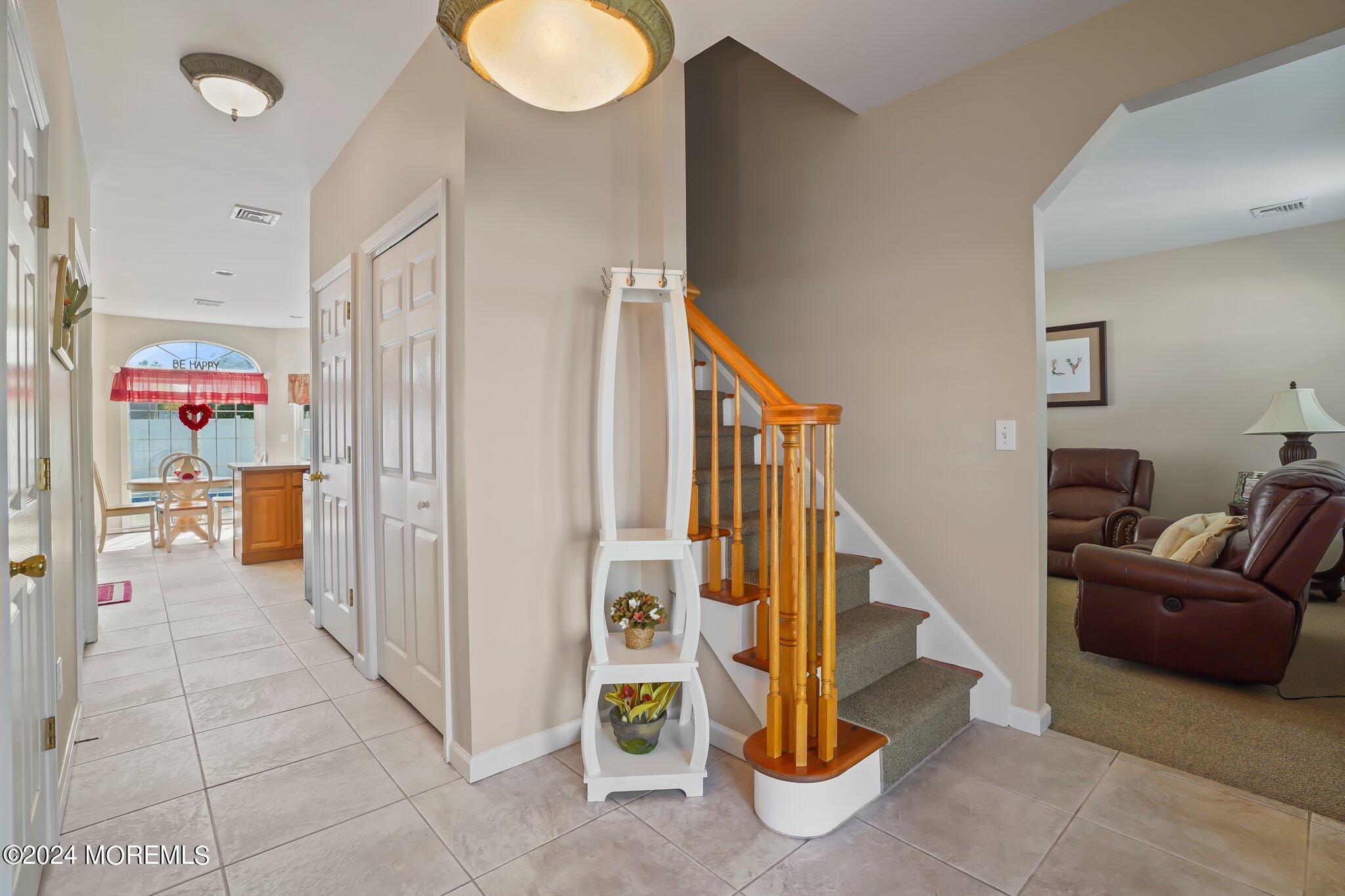 4 Anderson Street Union Beach, NJ 07735 - Photo 11 of 51 a view of a hallway with windows and stairs