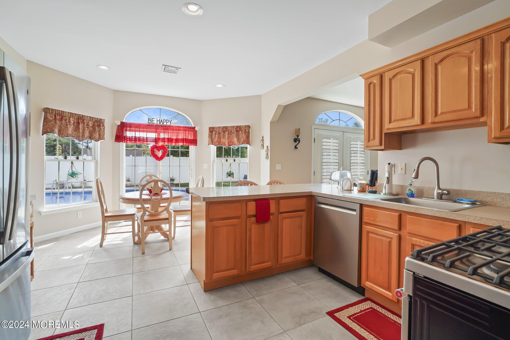 4 Anderson Street Union Beach, NJ 07735 - Photo 12 of 51 a kitchen with stainless steel appliances granite countertop a sink and cabinets