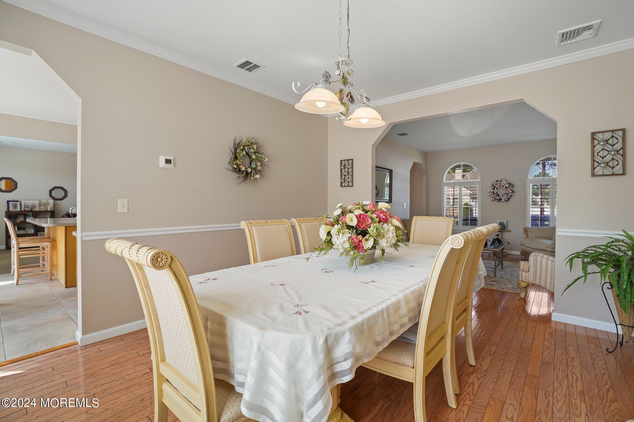 4 Anderson Street Union Beach, NJ 07735 - Photo 17 of 51 a view of a dining room with furniture and wooden floor