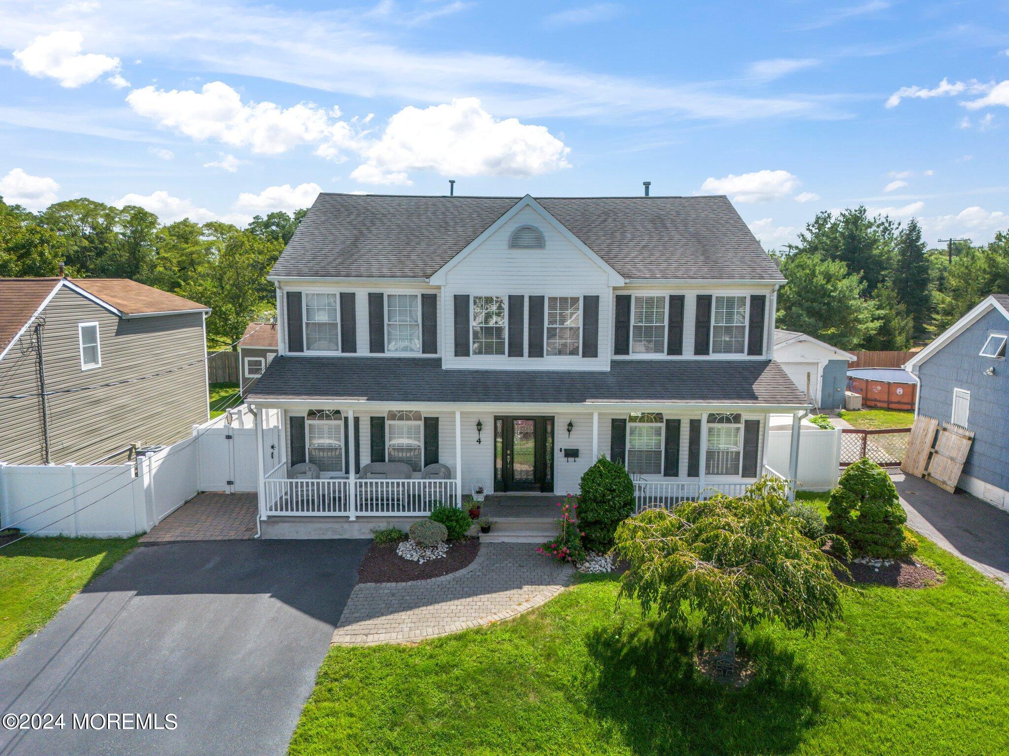 4 Anderson Street Union Beach, NJ 07735 - Photo 2 of 51 a front view of a house with garden
