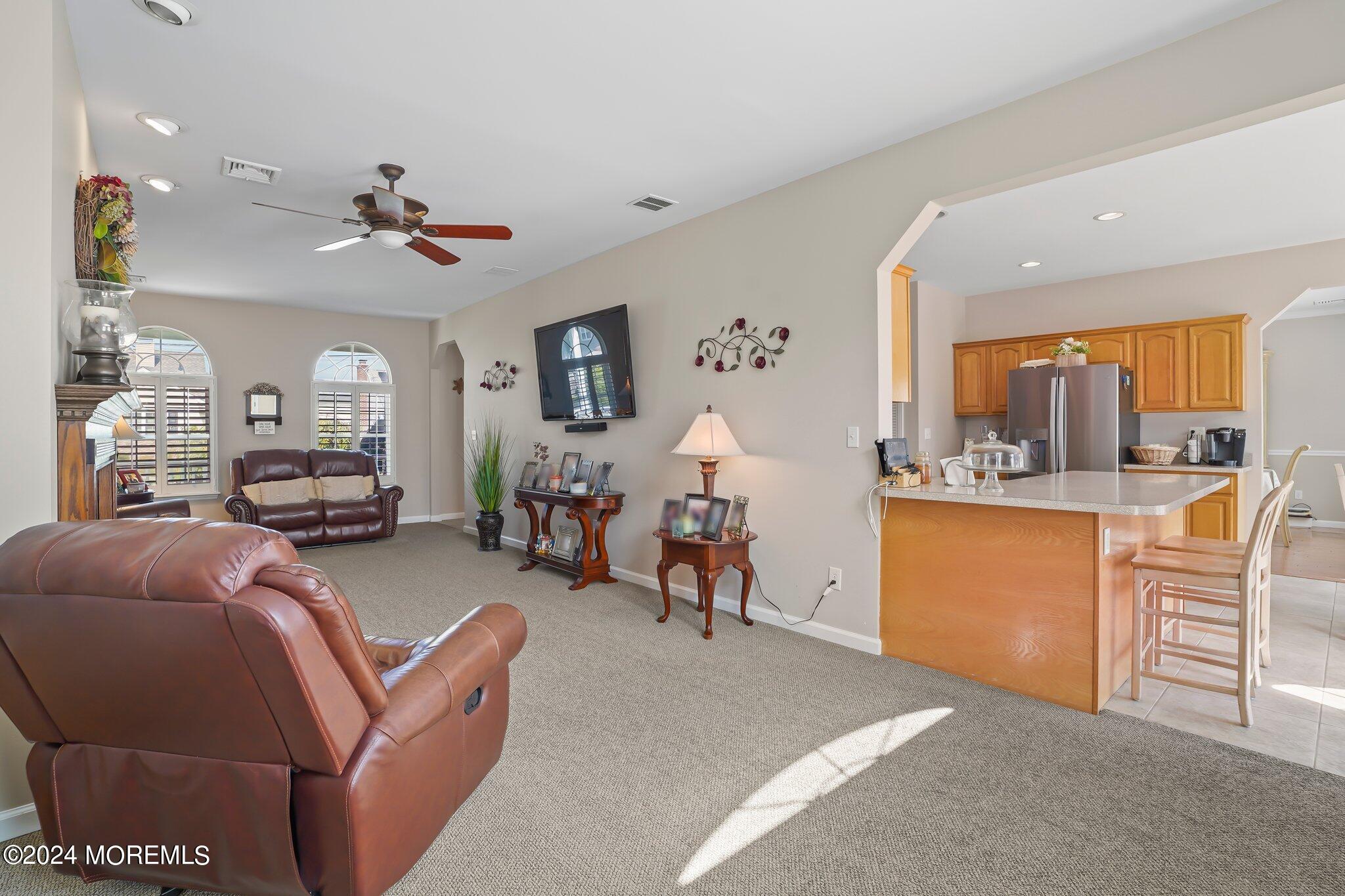 4 Anderson Street Union Beach, NJ 07735 - Photo 23 of 51 a living room with furniture a couch and kitchen view