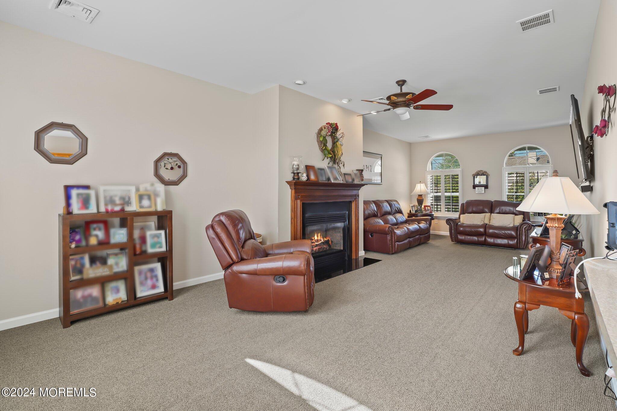 4 Anderson Street Union Beach, NJ 07735 - Photo 24 of 51 a living room with furniture a couch and a fireplace