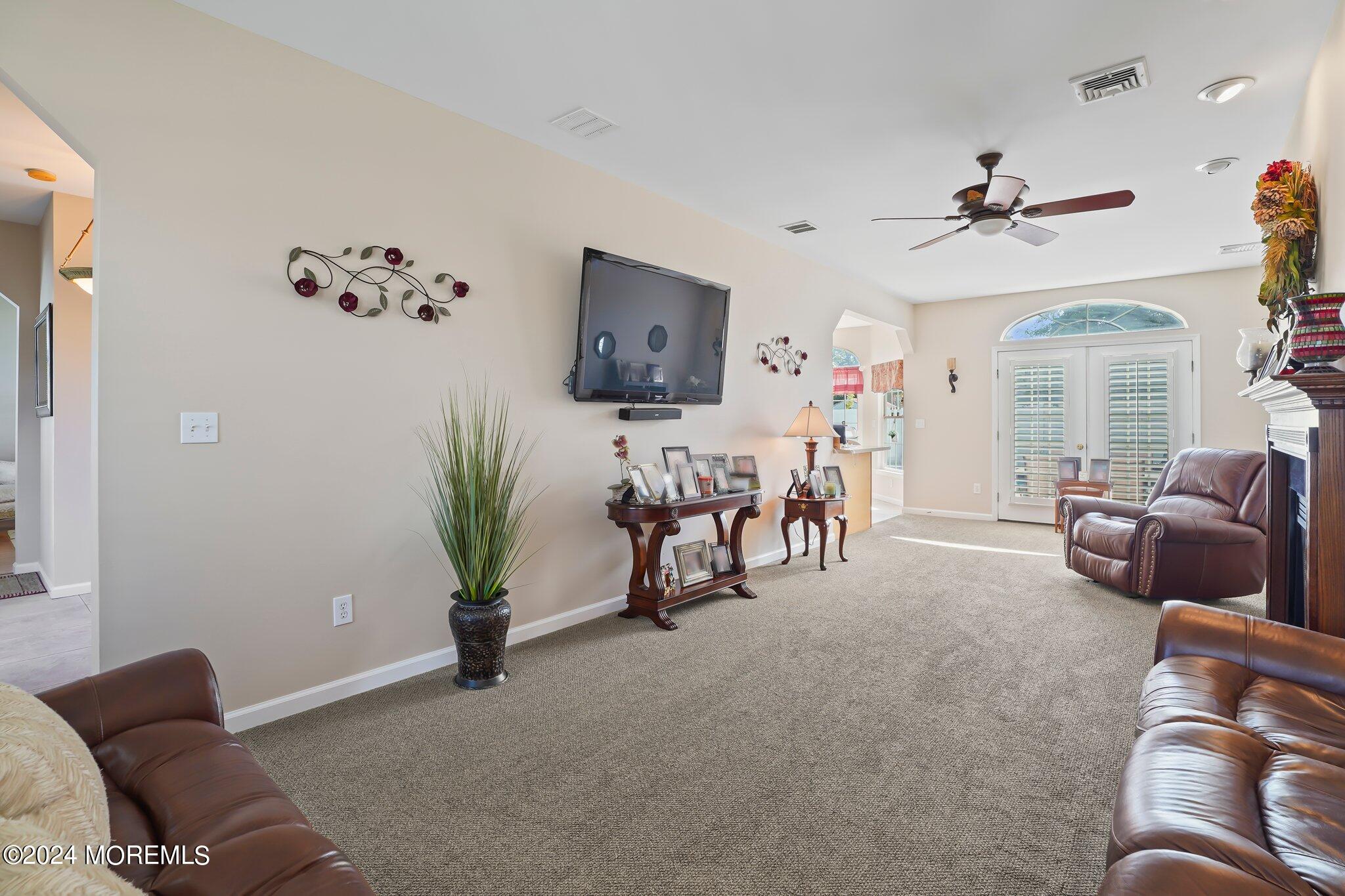 4 Anderson Street Union Beach, NJ 07735 - Photo 25 of 51 a living room with furniture and a flat screen tv