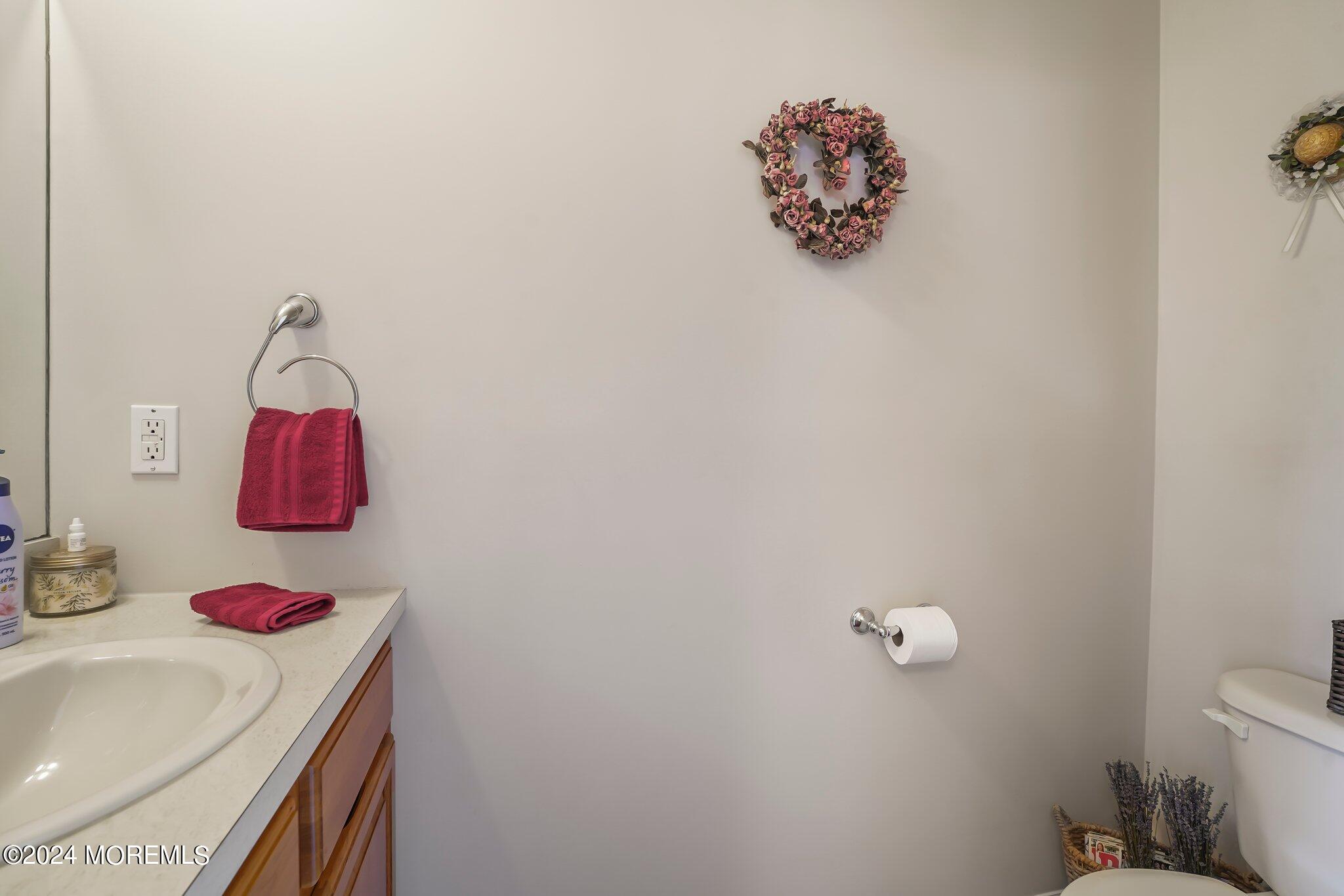 4 Anderson Street Union Beach, NJ 07735 - Photo 26 of 51 a bathroom with a sink mirror and toilet