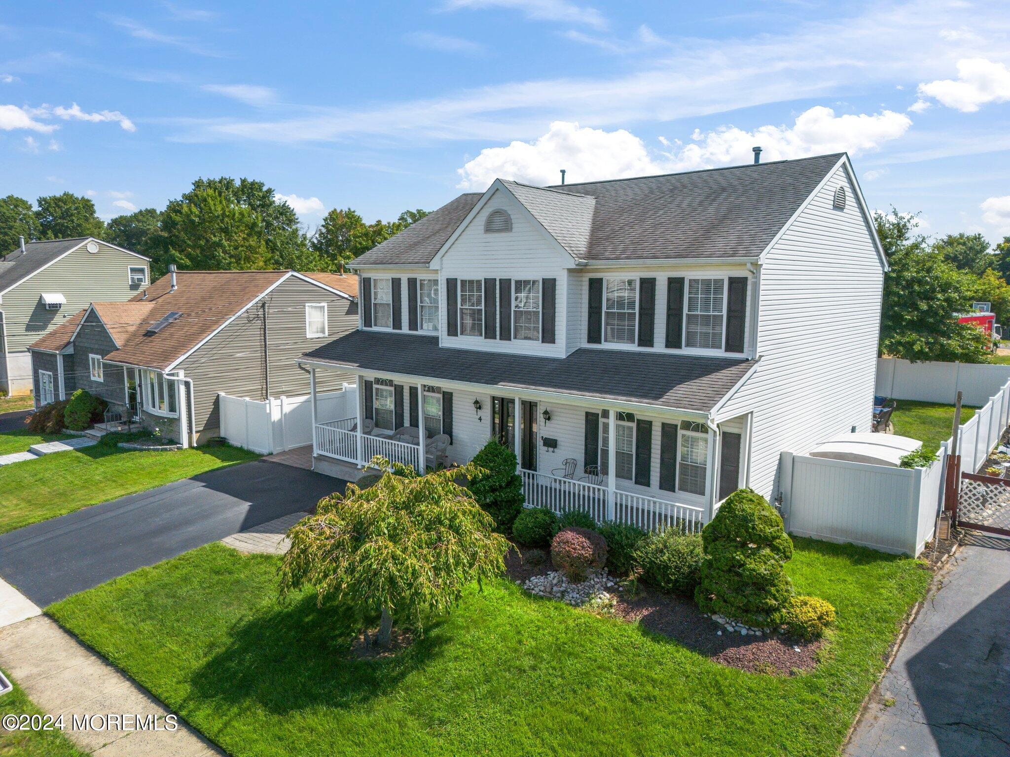 4 Anderson Street Union Beach, NJ 07735 - Photo 3 of 51 a aerial view of a house next to a yard
