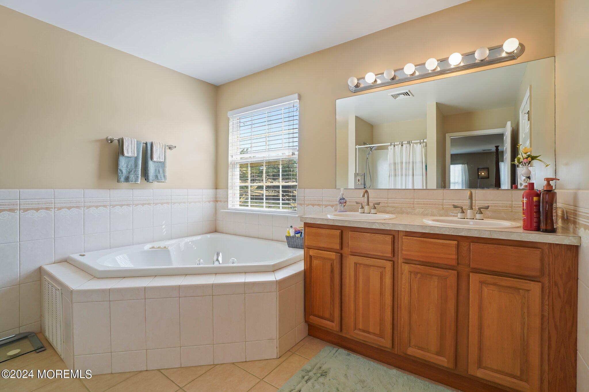 4 Anderson Street Union Beach, NJ 07735 - Photo 31 of 51 a bath tub sitting next to a bathroom sink