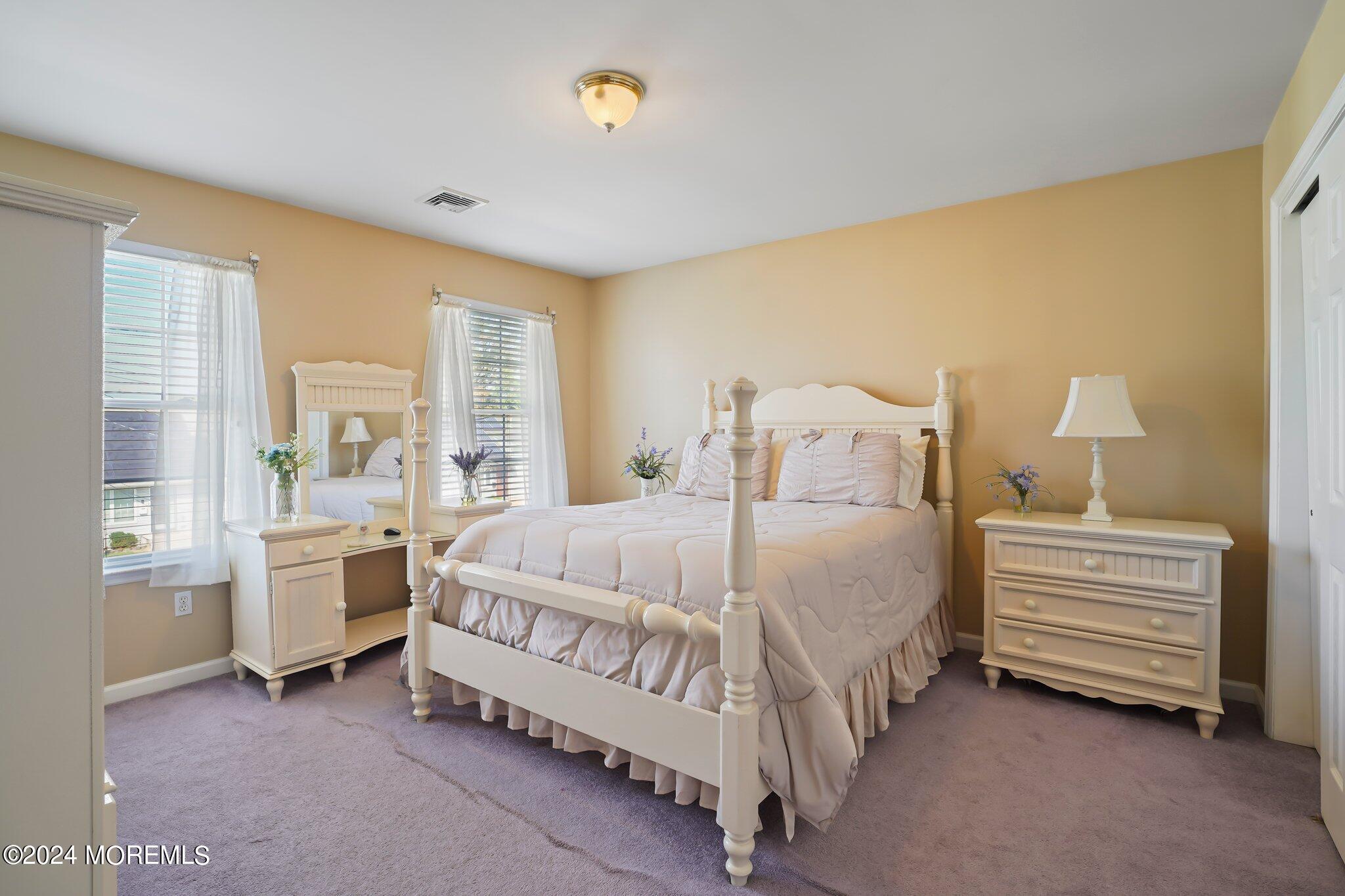 4 Anderson Street Union Beach, NJ 07735 - Photo 34 of 51 a spacious bedroom with a bed and a table in it