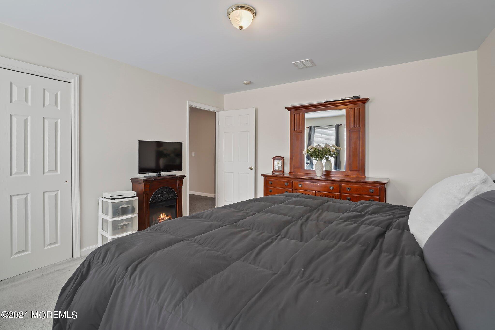 4 Anderson Street Union Beach, NJ 07735 - Photo 37 of 51 a bedroom with a bed and a flat screen tv