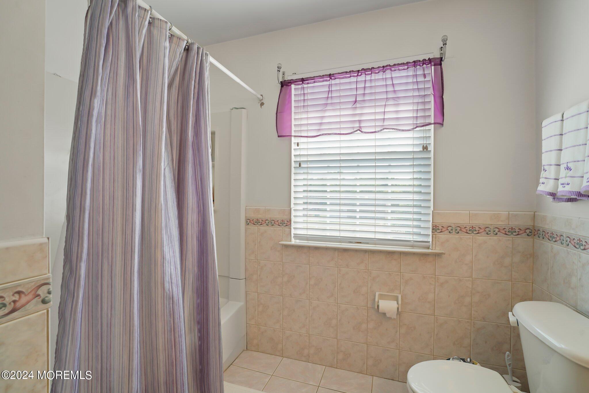 4 Anderson Street Union Beach, NJ 07735 - Photo 38 of 51 a bathroom with a toilet a sink and a window