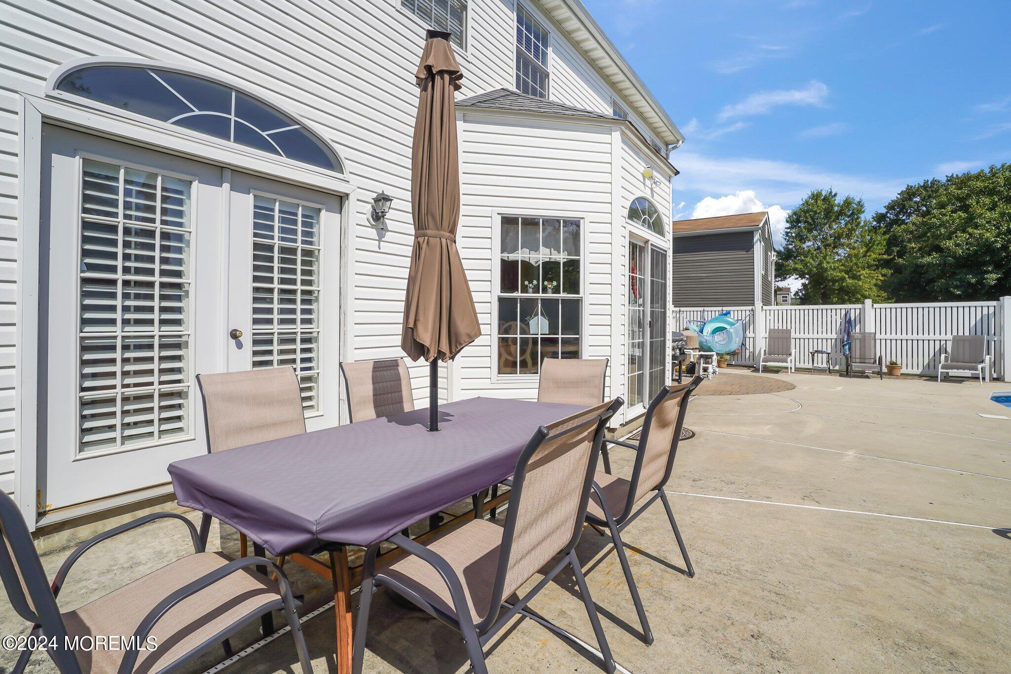 4 Anderson Street Union Beach, NJ 07735 - Photo 40 of 51 a view of a patio with a table and chairs