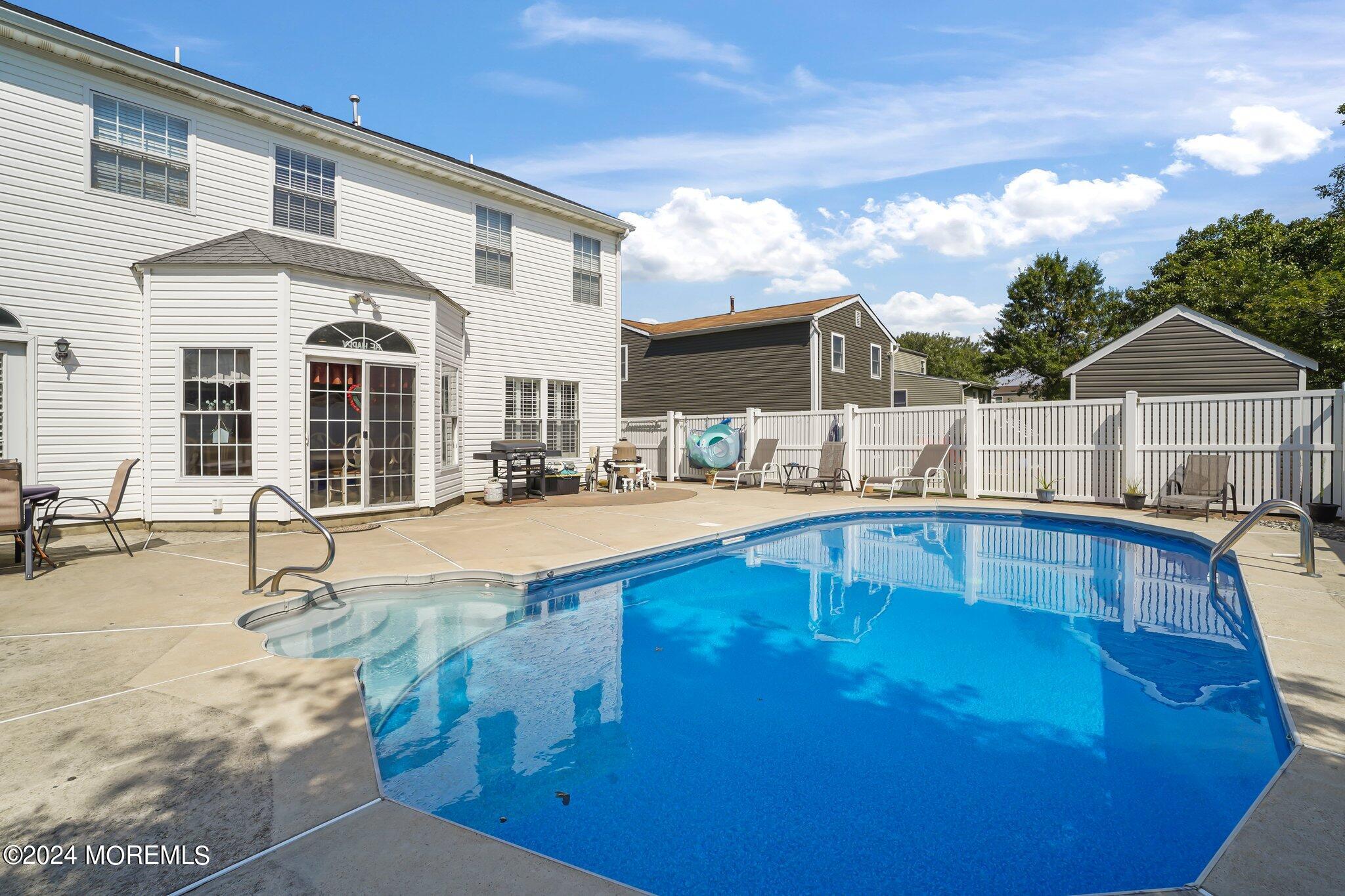 4 Anderson Street Union Beach, NJ 07735 - Photo 42 of 51 a view of a house with swimming pool