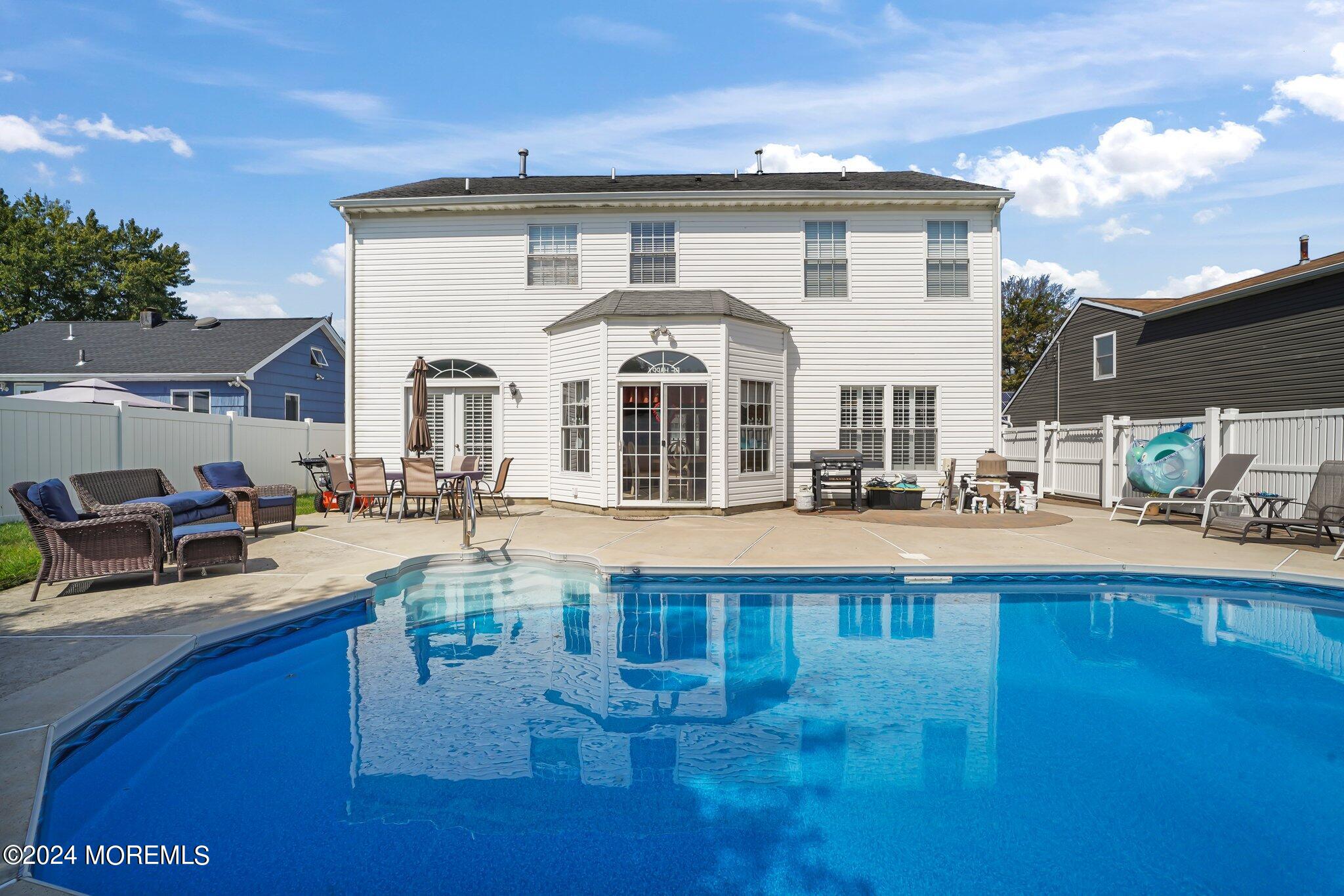4 Anderson Street Union Beach, NJ 07735 - Photo 43 of 51 a view of a house with pool and chairs
