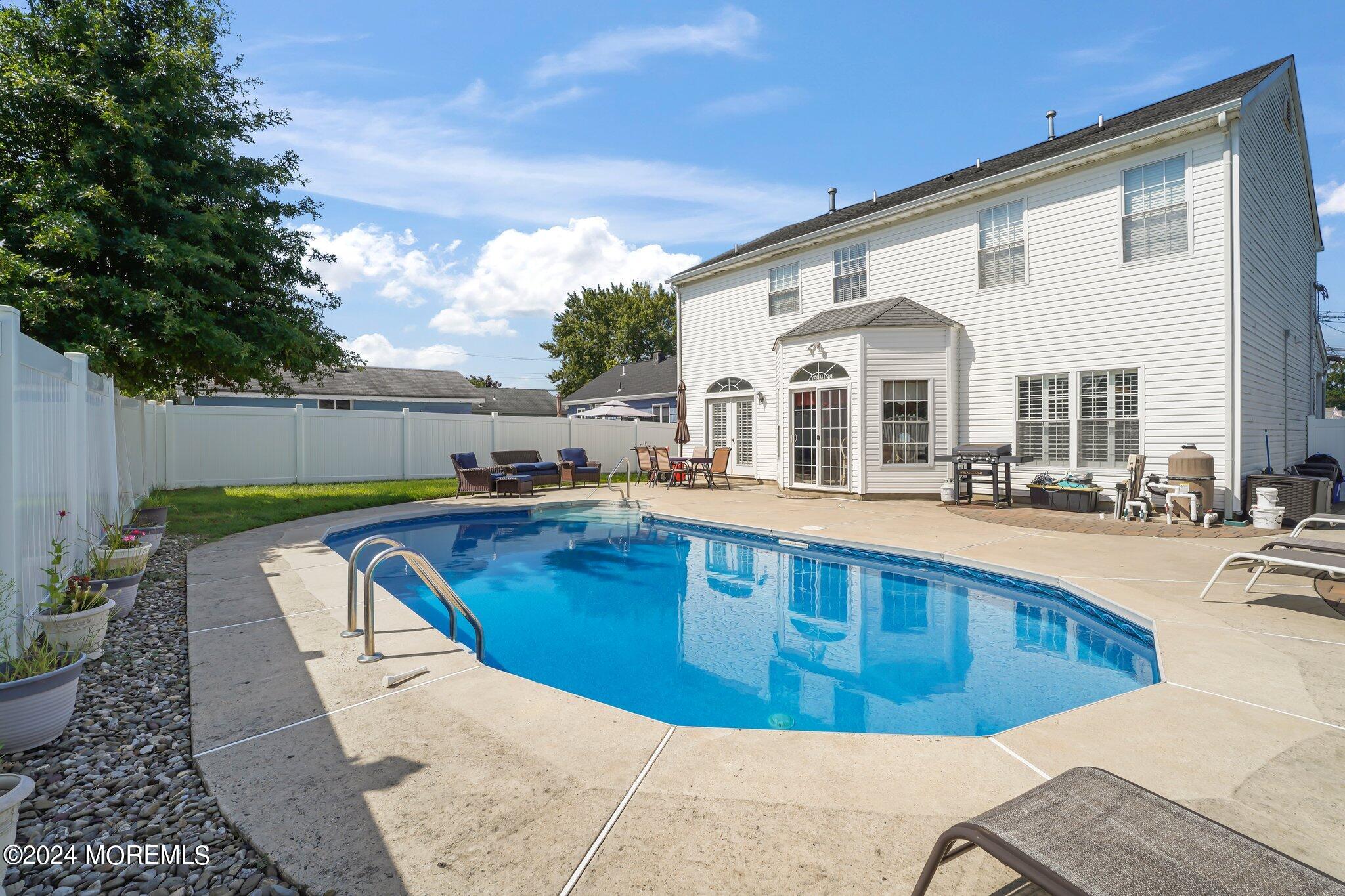 4 Anderson Street Union Beach, NJ 07735 - Photo 45 of 51 a view of a swimming pool with lounge chair