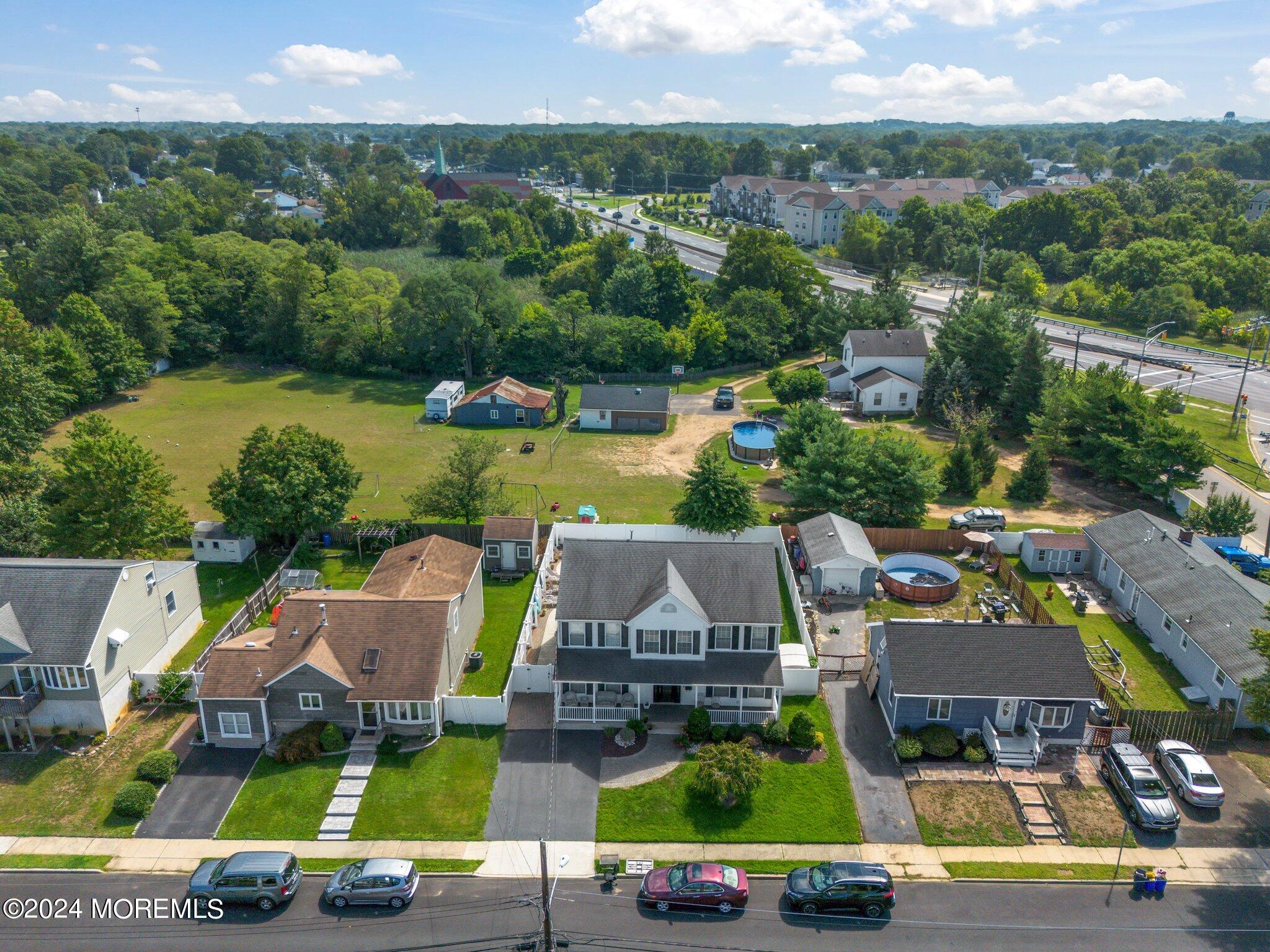 4 Anderson Street Union Beach, NJ 07735 - Photo 49 of 51 an aerial view of a house with garden space and street view