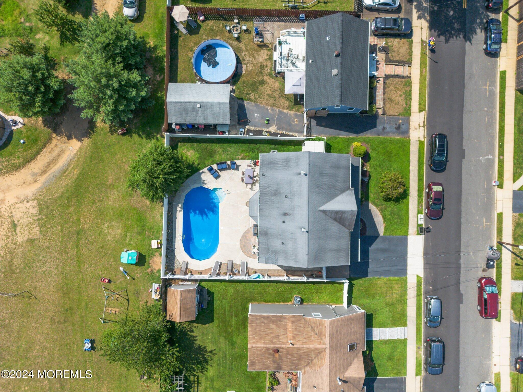 4 Anderson Street Union Beach, NJ 07735 - Photo 51 of 51 an aerial view of a house with a yard and pool