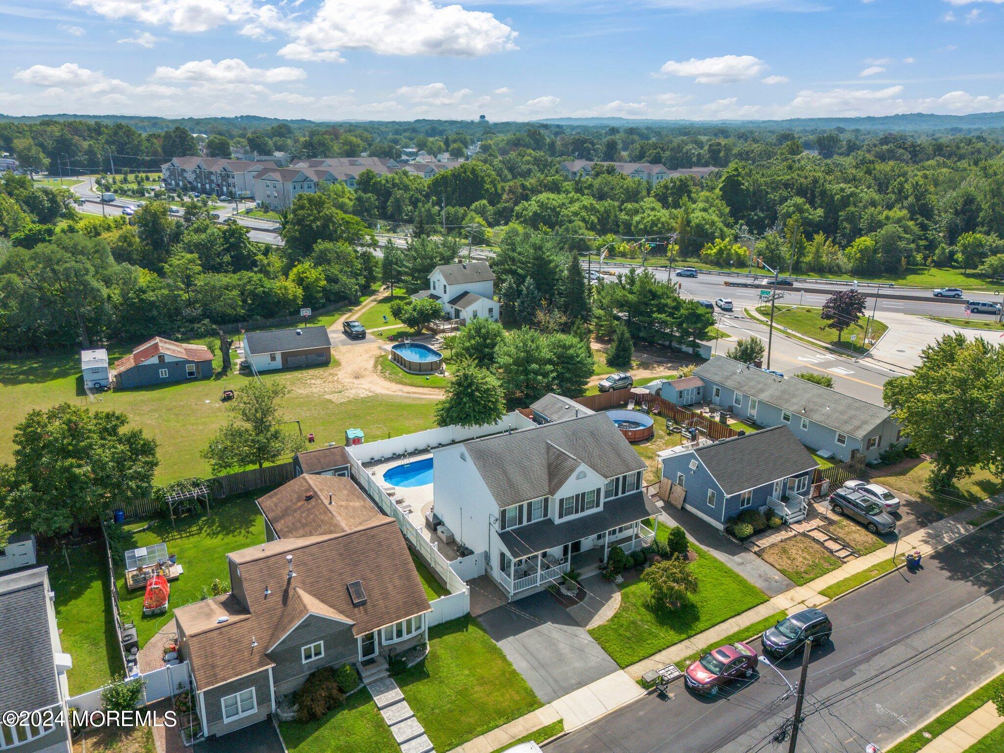 4 Anderson Street Union Beach, NJ 07735 - Photo 8 of 51 an aerial view of a house with a garden and lake view