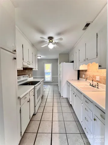 a large kitchen with cabinets