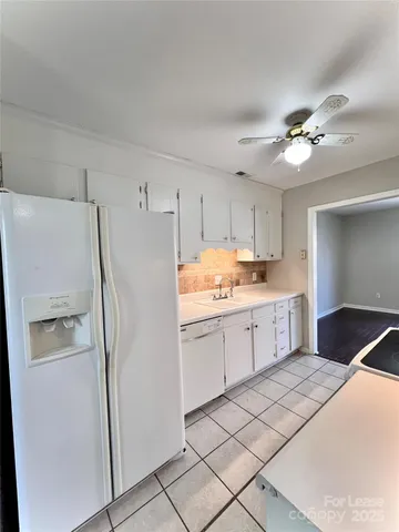 a kitchen with a refrigerator a sink and dishwasher