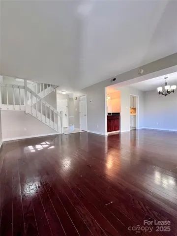 a view of a livingroom with wooden floor