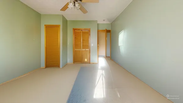 a view of an empty room with a window