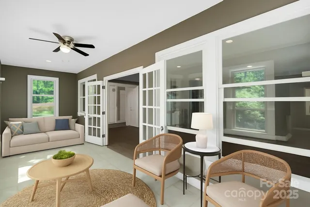 a living room with furniture and a large window