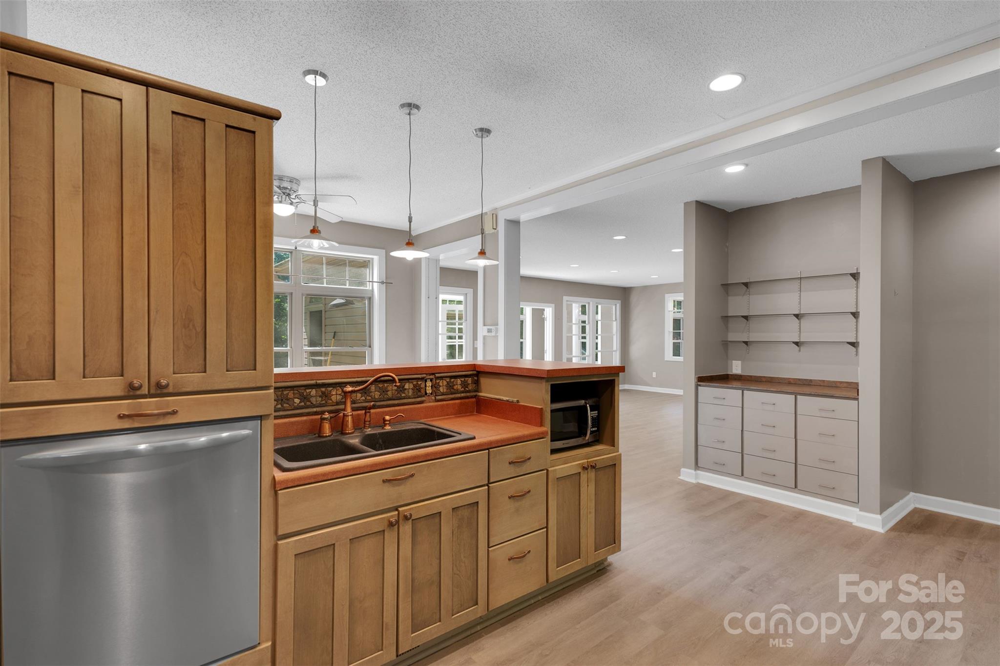 3333 Roberta Road Concord, NC 28027 - Photo 17 of 47 a kitchen with a refrigerator and white cabinets