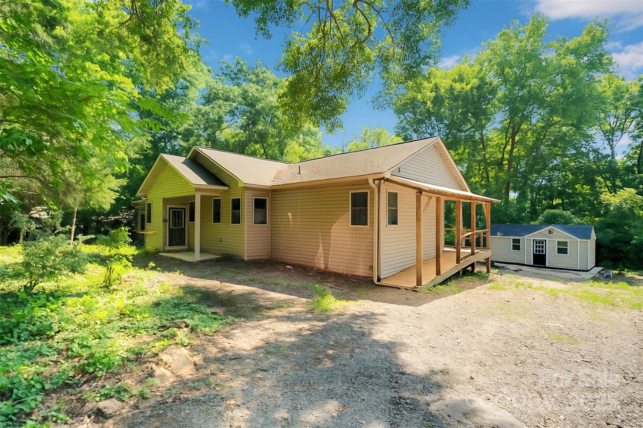 3333 Roberta Road Concord, NC 28027 - Photo 3 of 47 a view of a white house with a large yard and large trees