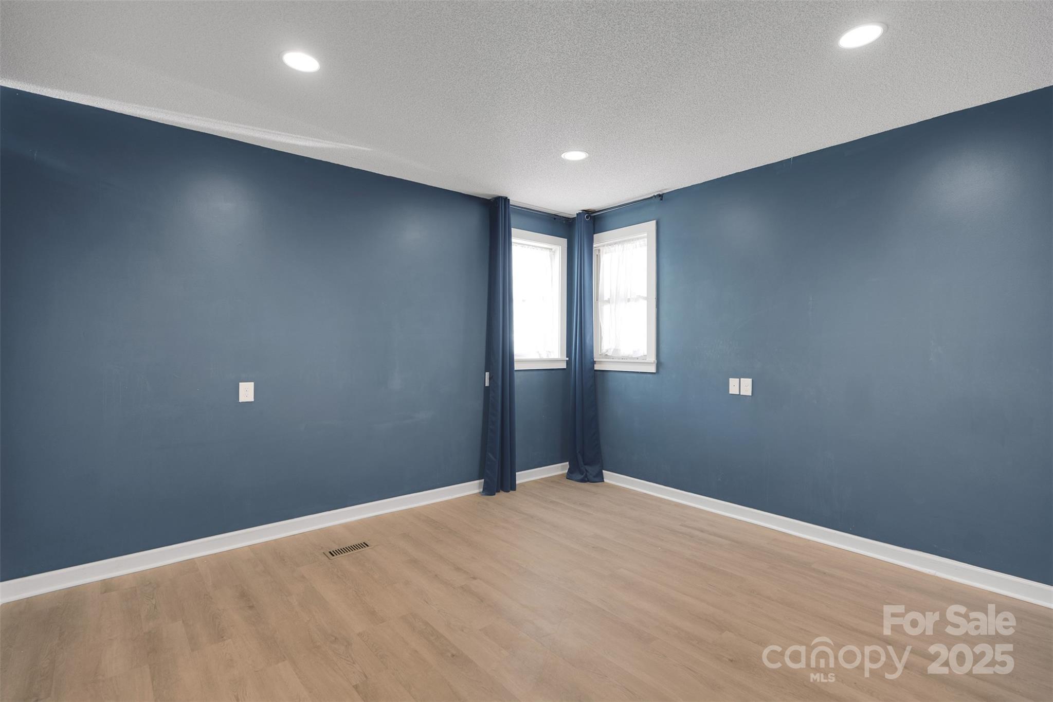 3333 Roberta Road Concord, NC 28027 - Photo 32 of 47 a view of an empty room with wooden floor and a window
