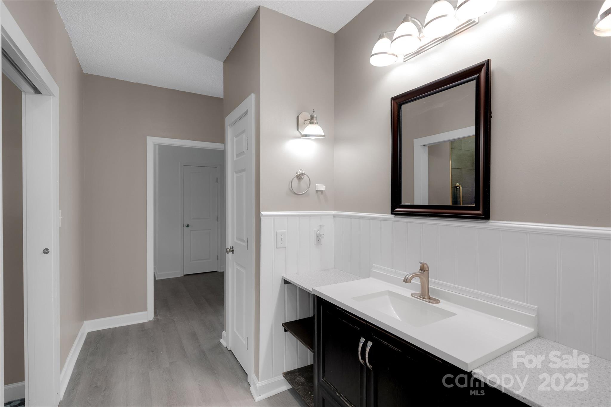 3333 Roberta Road Concord, NC 28027 - Photo 35 of 47 a en suite bathroom with a double vanity sink and a mirror