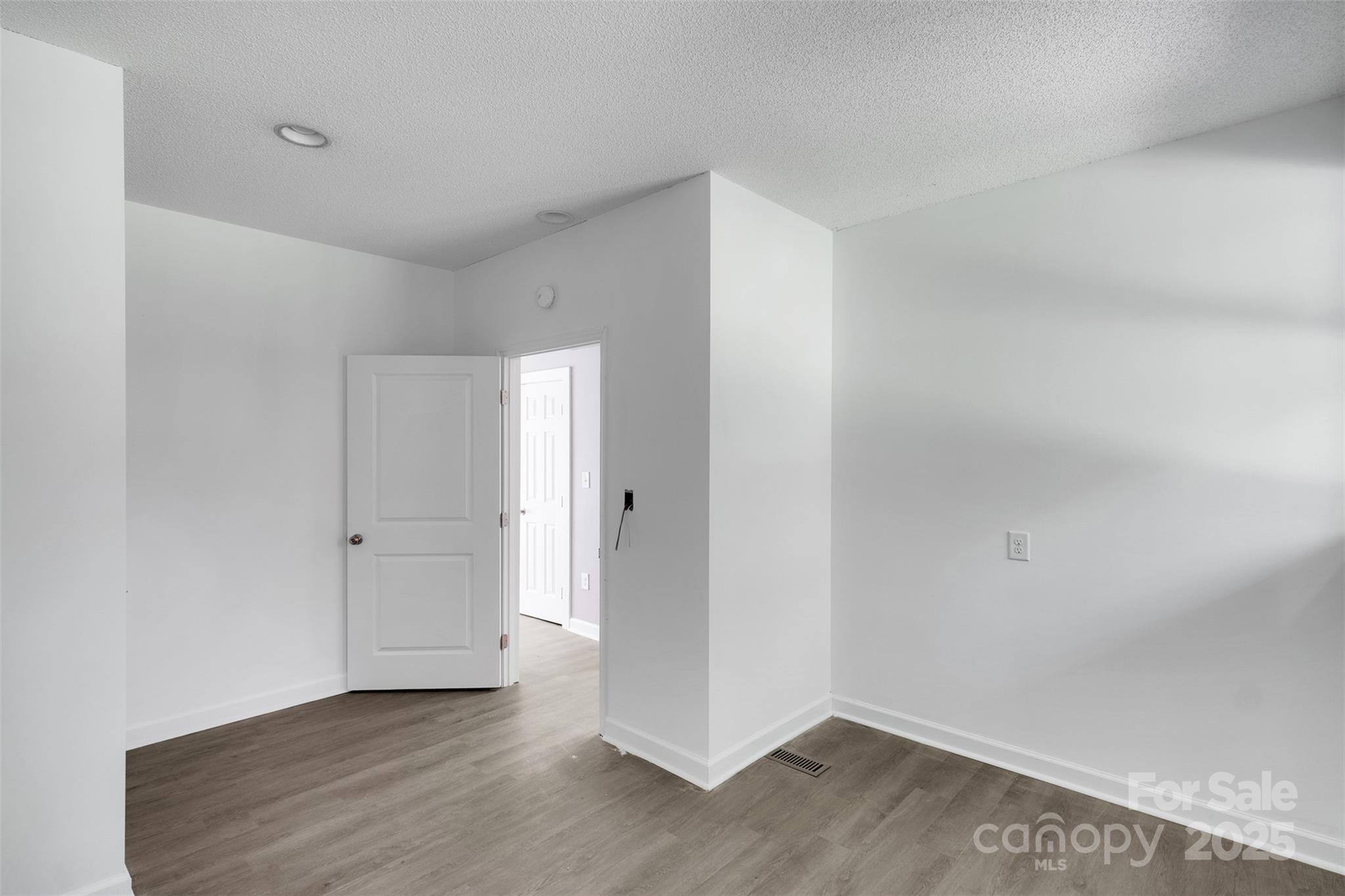 3333 Roberta Road Concord, NC 28027 - Photo 37 of 47 a view of an empty room with wooden floor