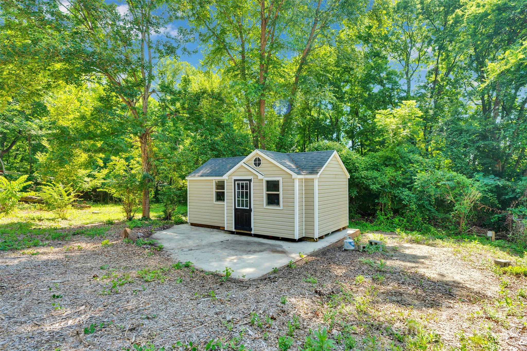 3333 Roberta Road Concord, NC 28027 - Photo 40 of 47 a view of a house with large trees plants and large tree