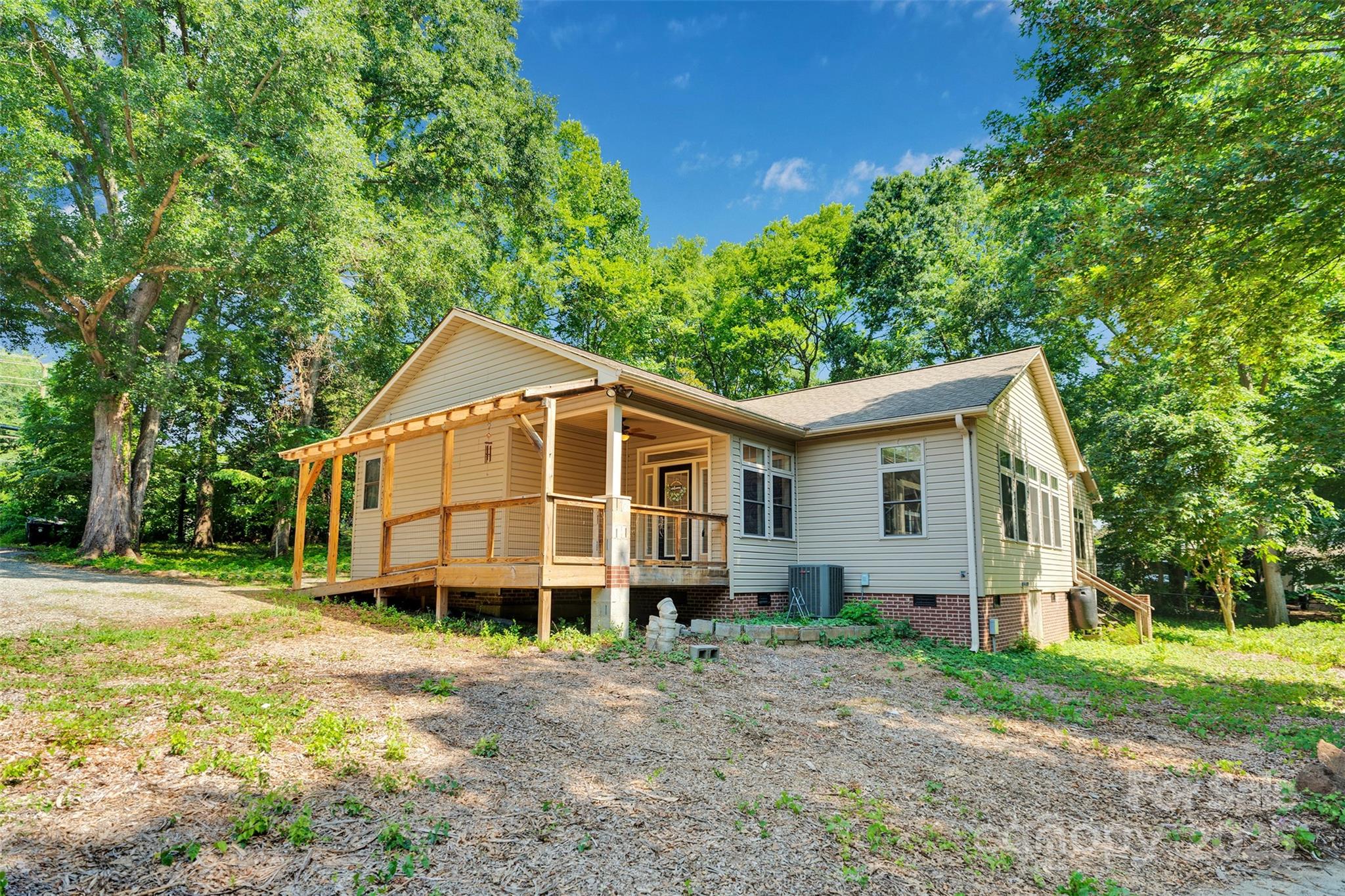3333 Roberta Road Concord, NC 28027 - Photo 4 of 47 a view of a house with a yard and large trees