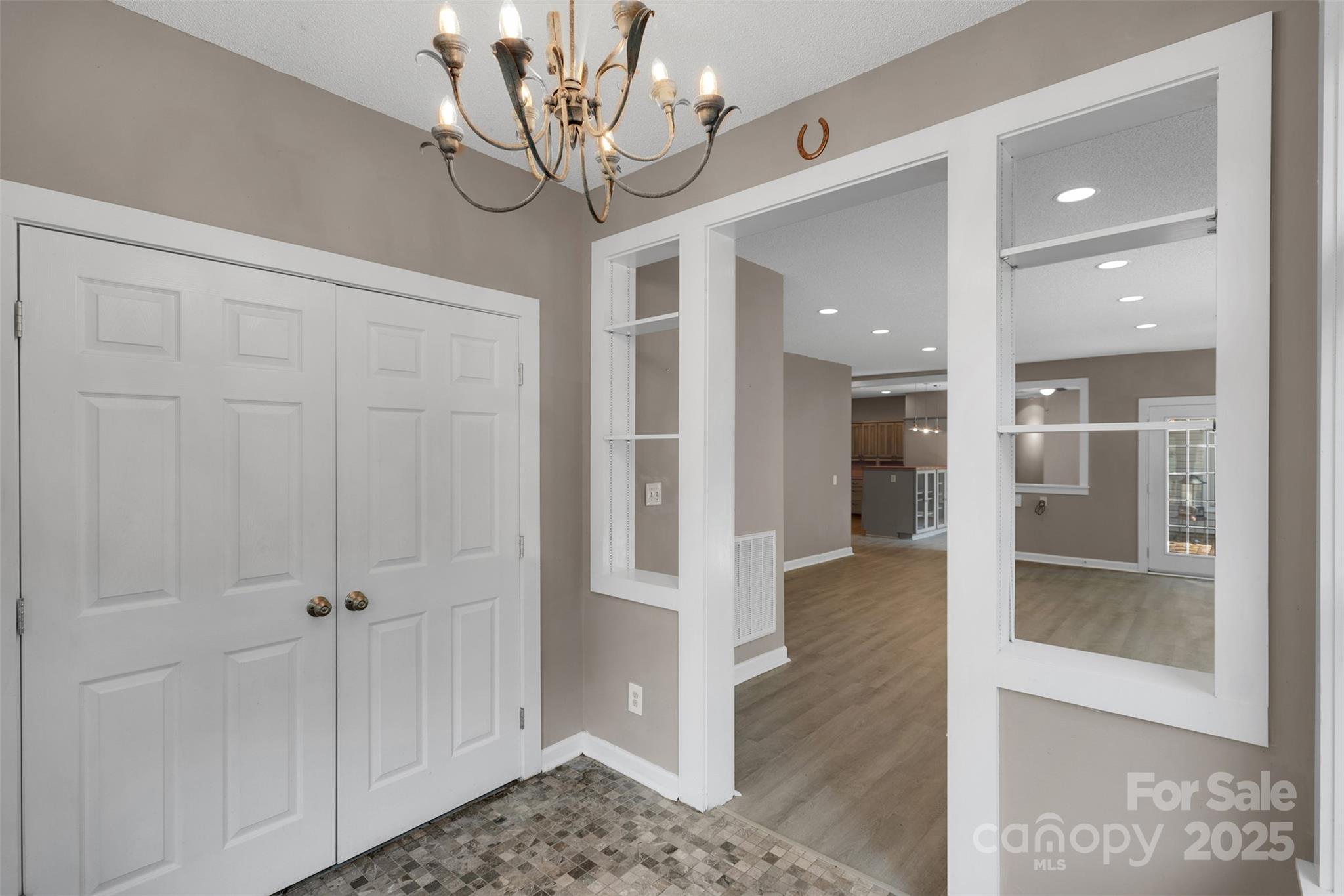 3333 Roberta Road Concord, NC 28027 - Photo 8 of 47 a view of a hallway with wooden floor and staircase