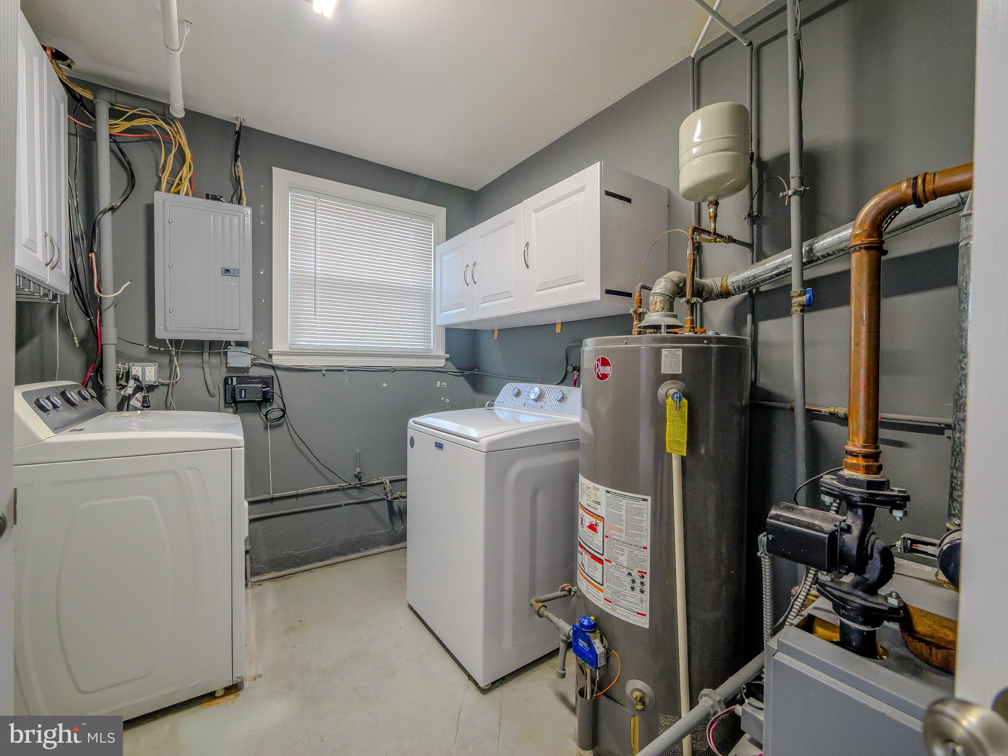 520 Lindsay Street Ridley Park, PA 19078 - Photo 12 of 53 a utility room with cabinets dryer and washer