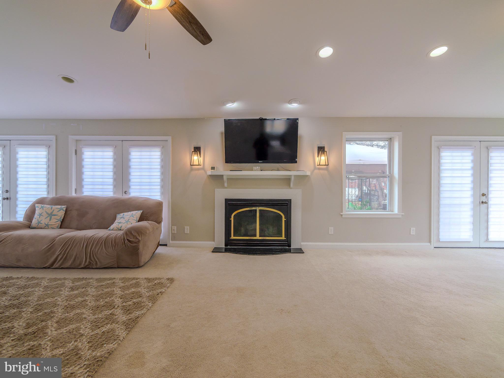 520 Lindsay Street Ridley Park, PA 19078 - Photo 19 of 53 a living room with furniture a flat screen tv and a fireplace