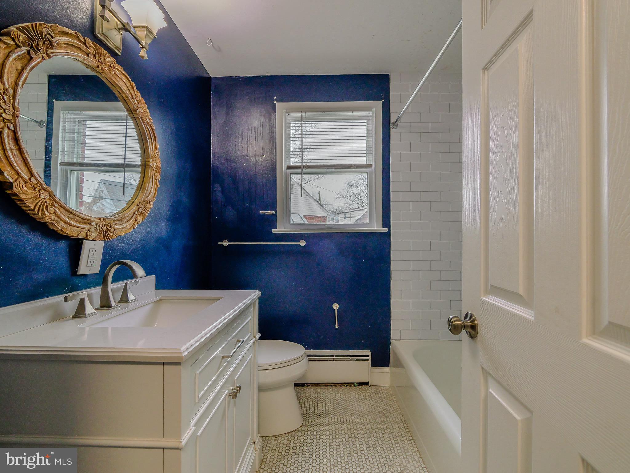 520 Lindsay Street Ridley Park, PA 19078 - Photo 24 of 53 a bathroom with a toilet sink and mirror