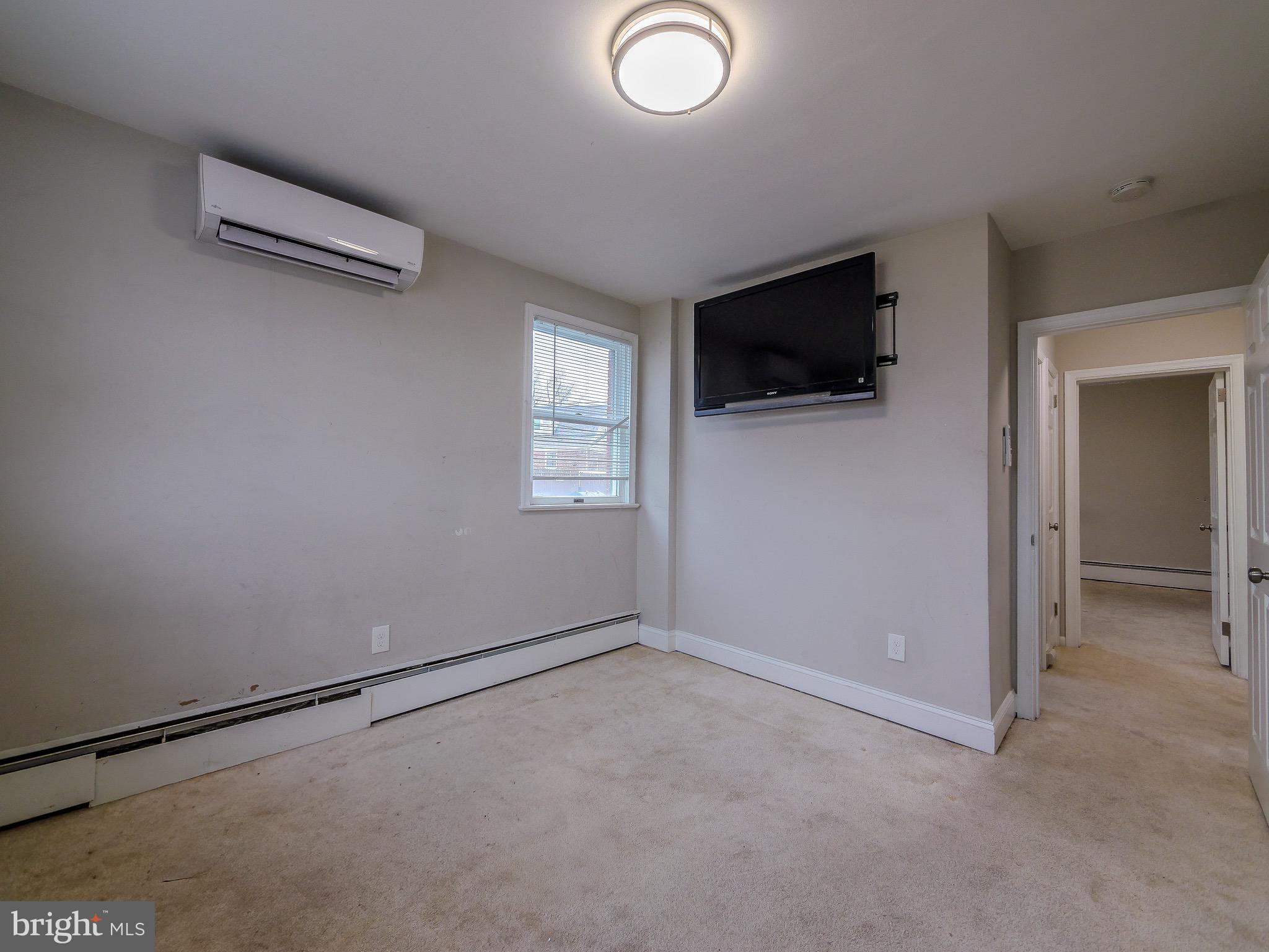 520 Lindsay Street Ridley Park, PA 19078 - Photo 28 of 53 an empty room with wooden floor and windows