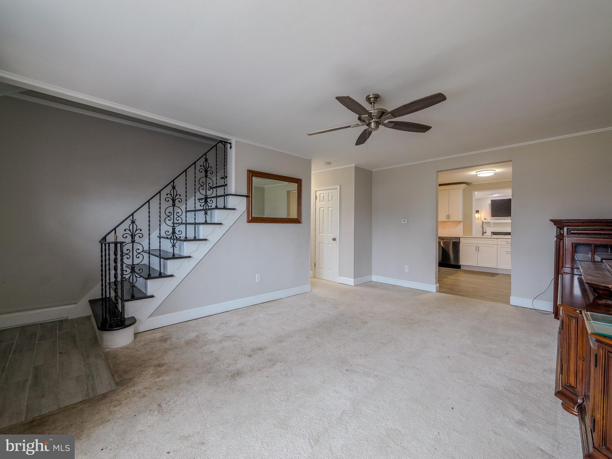 520 Lindsay Street Ridley Park, PA 19078 - Photo 3 of 53 a view of a livingroom with a ceiling fan and staircase