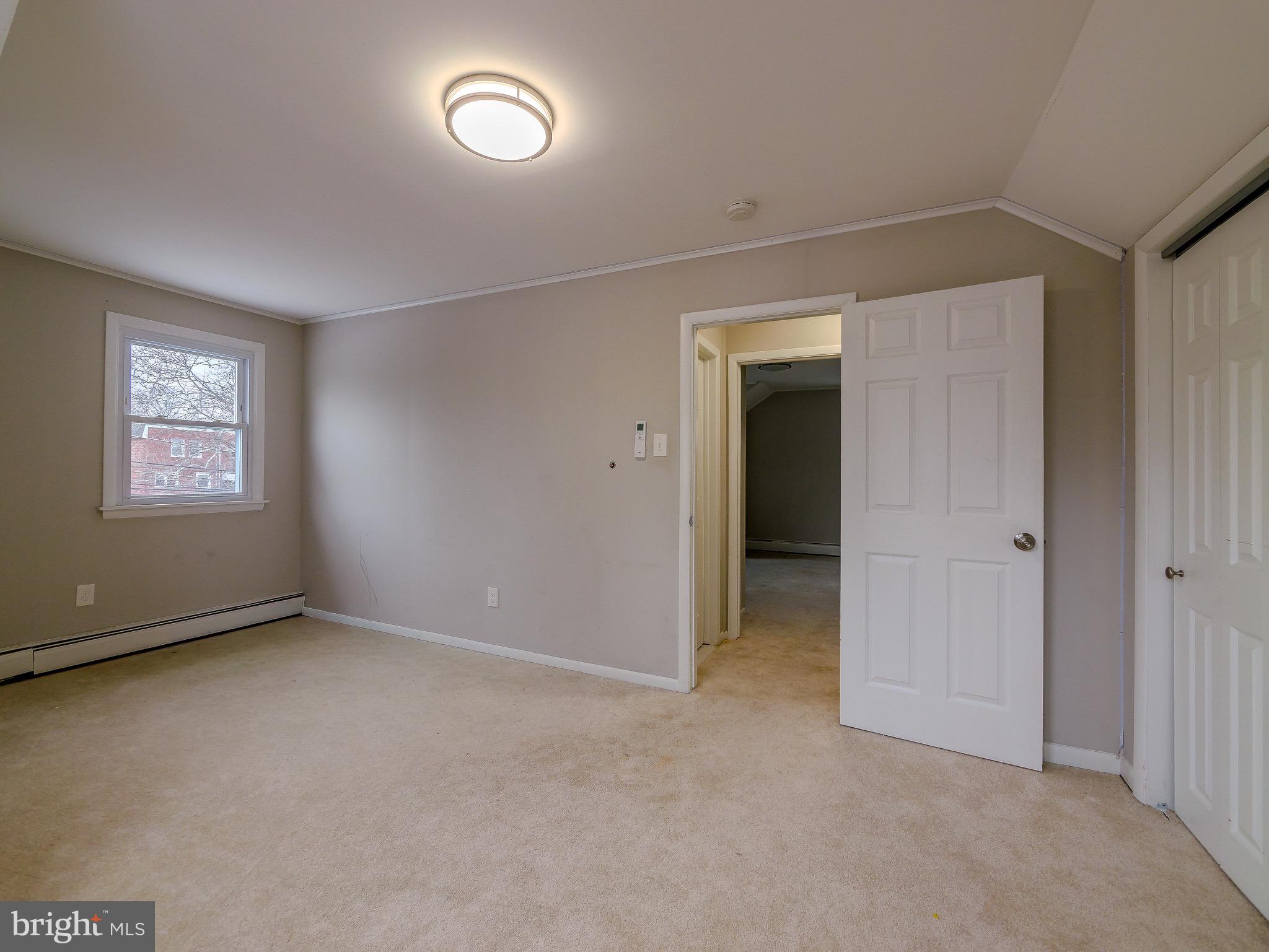 520 Lindsay Street Ridley Park, PA 19078 - Photo 37 of 53 an empty room with a window and closet