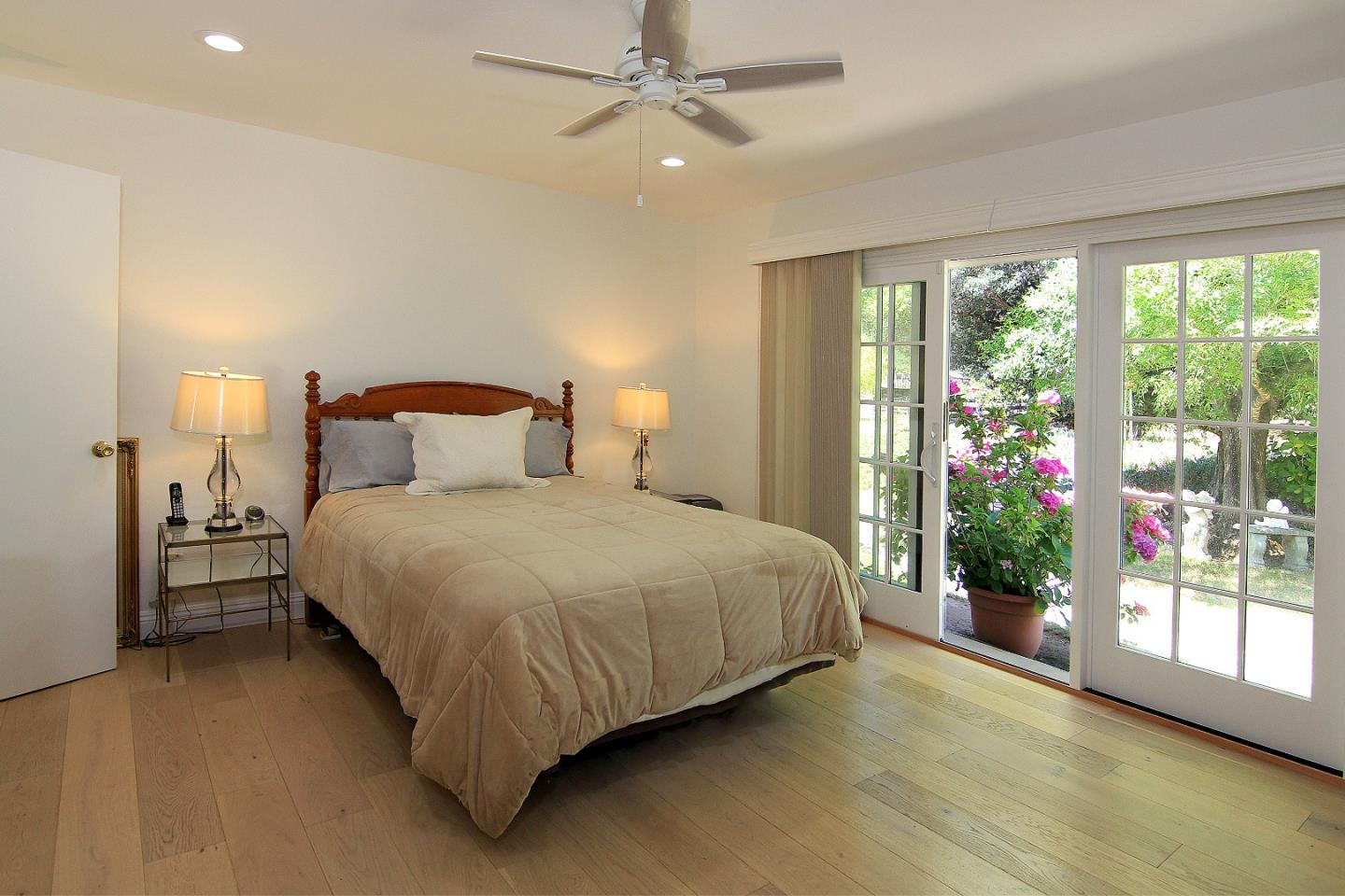155 Wheelock Road Watsonville, CA 95076 - Photo 13 of 36 a bedroom with a large bed and a large window