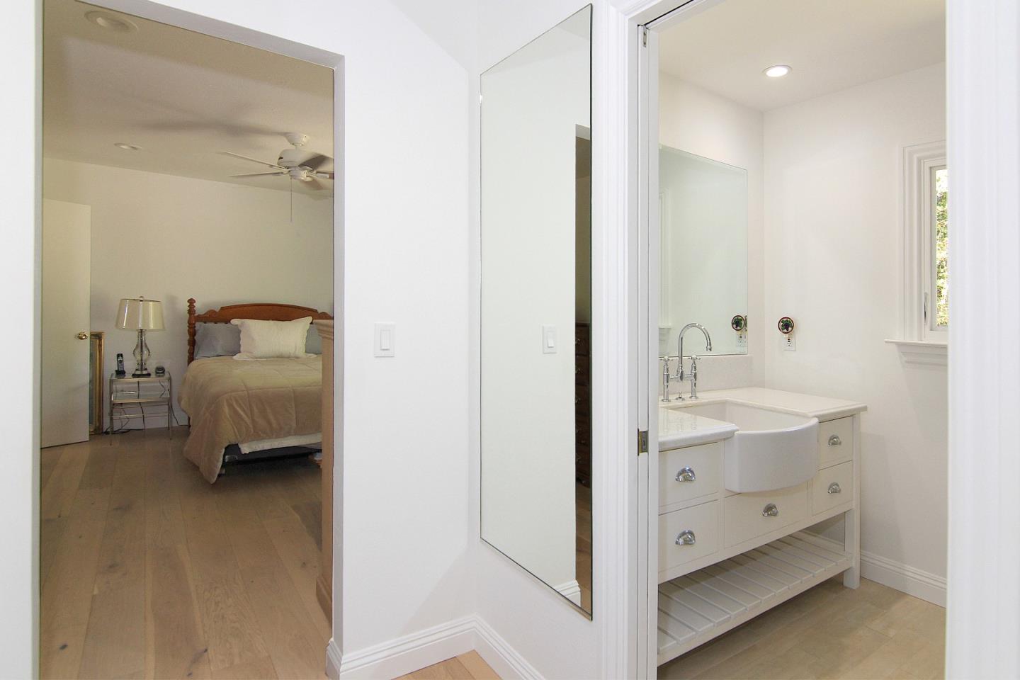 155 Wheelock Road Watsonville, CA 95076 - Photo 14 of 36 a en suite bathroom with a double vanity sink and mirror
