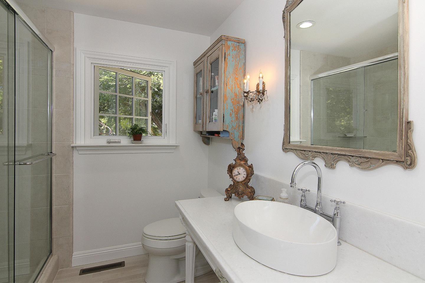 155 Wheelock Road Watsonville, CA 95076 - Photo 18 of 36 a bathroom with a toilet sink and mirror