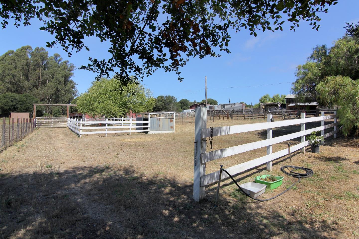 155 Wheelock Road Watsonville, CA 95076 - Photo 27 of 36 a view of a chairs and table in the backyard