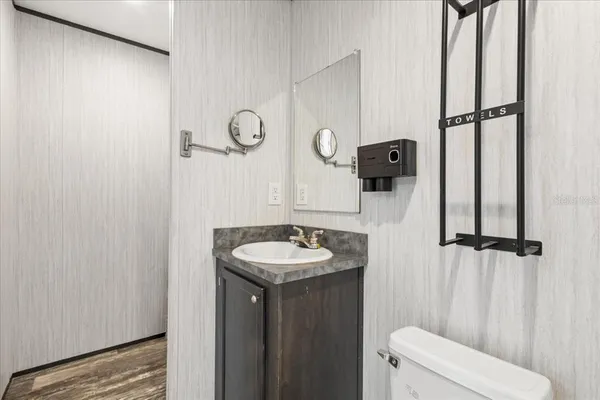 a bathroom with a sink and toilet