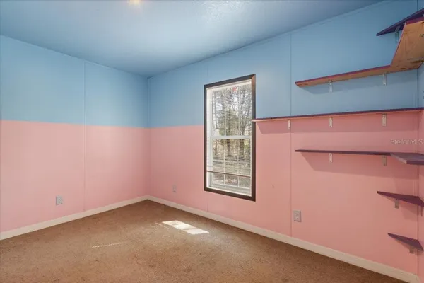 an empty room with windows