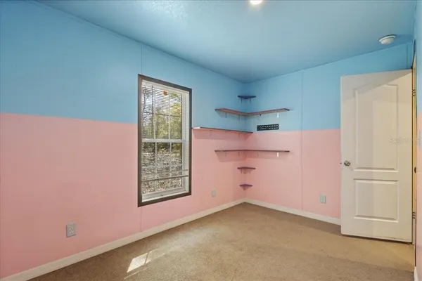 a room with cabinets and window