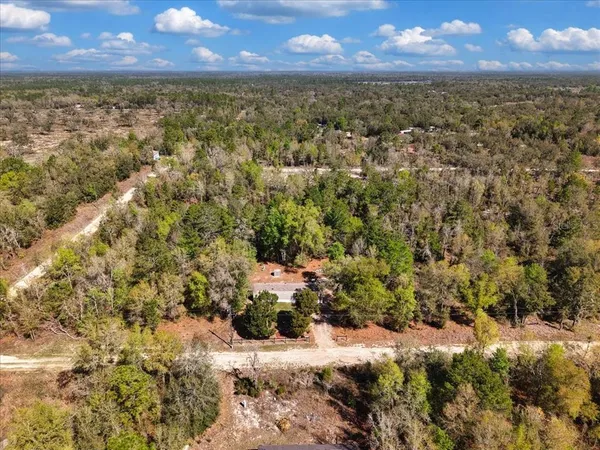 a view of a yard with a lake view