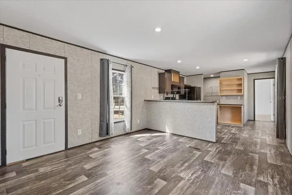 a view of kitchen with wooden floor