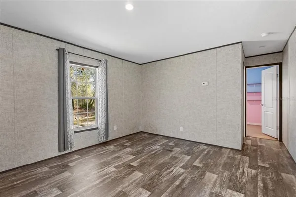 a view of an empty room with a window