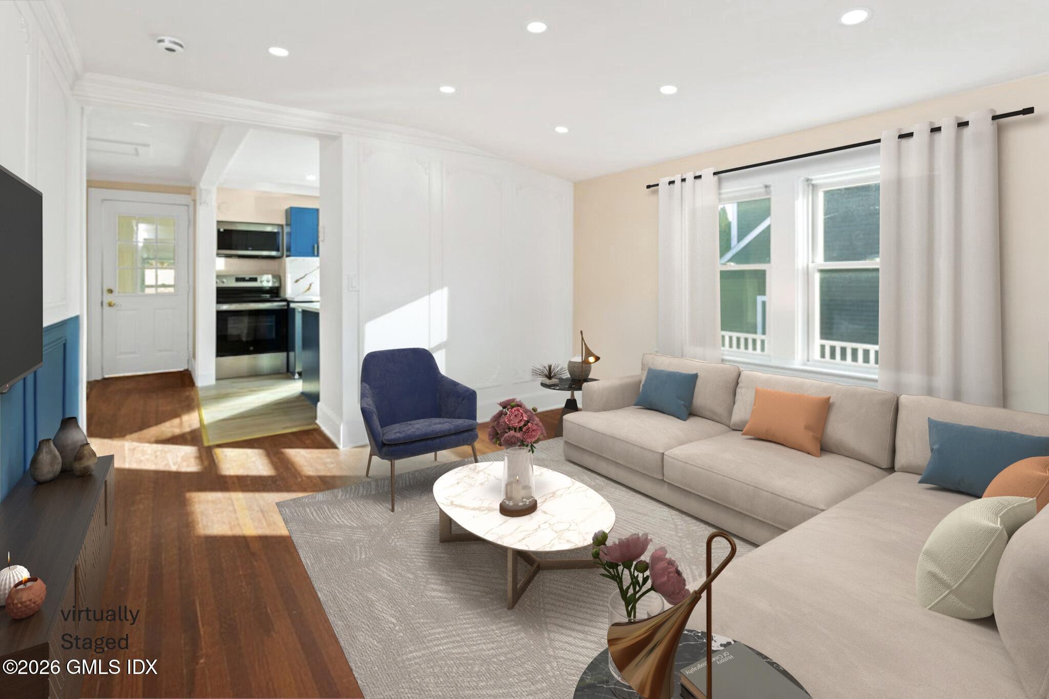 71 Prospect Street, Unit 2 Greenwich, CT 06830 - Photo 10 of 17 a living room with furniture and a wooden floor